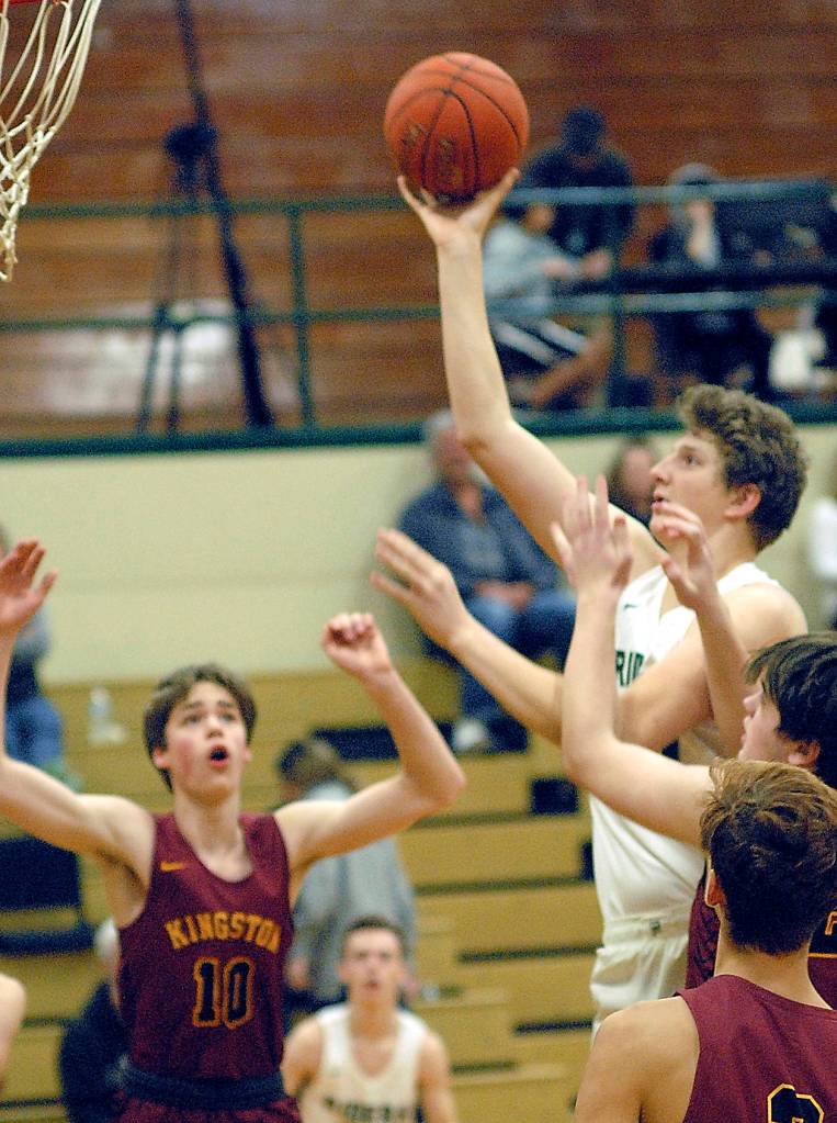 Port Angeles John Vaara goes up and over a collection of Kinston defenders for a layup during Wednesday nights game in Port Angeles. (Keith Thorpe /Peninsula Daily News)