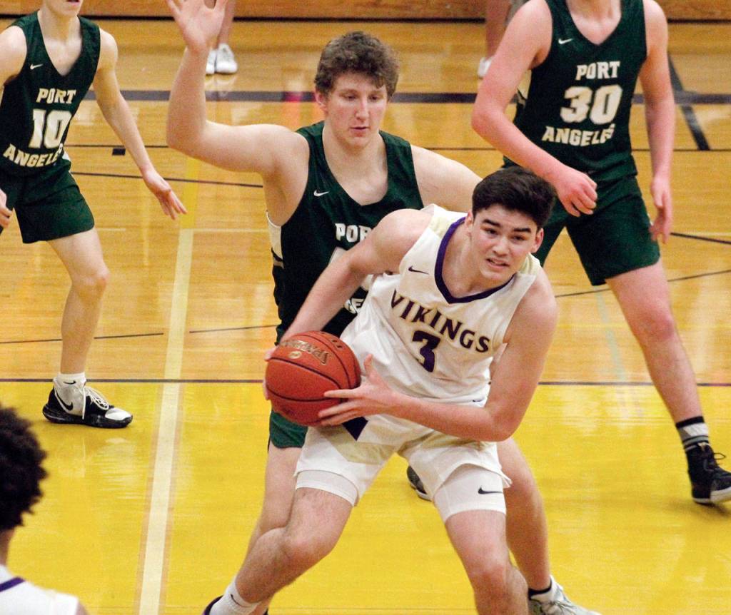 Port Angeles John Vaara looks to close off the room to maneuver for North Kitsaps Aiden Olmstead (Mark Krulish/Kitsap News Group)