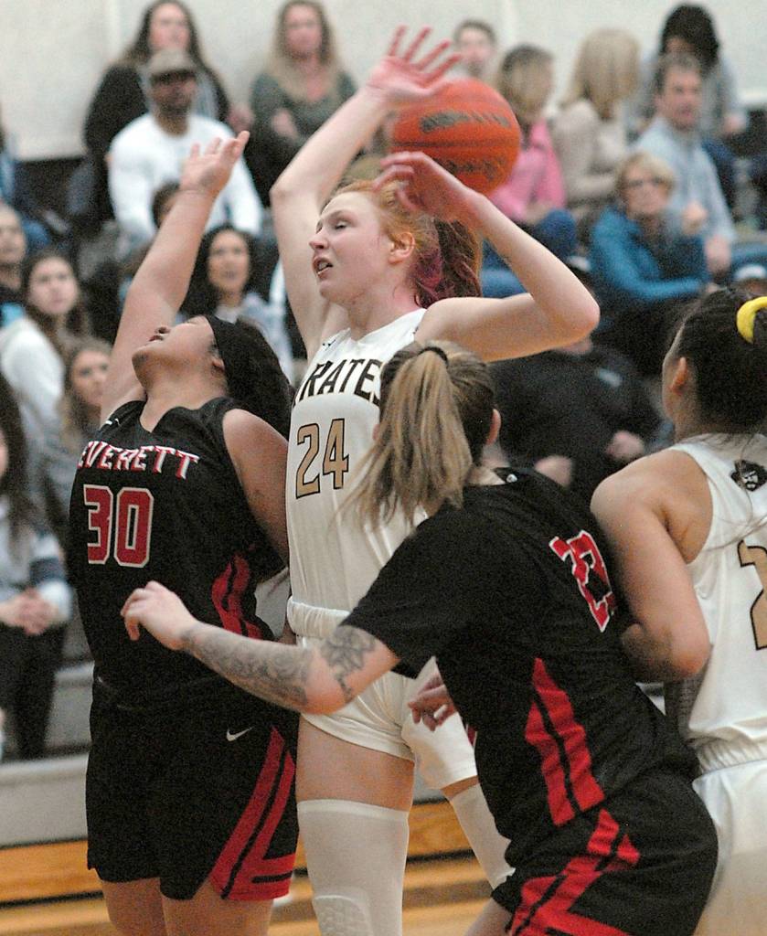 Keith Thorpe/Peninsula Daily News Peninsulas Kameron Bowen, top, tries for a rebound that gets over her head surrounded by, from left, Everetts Raven Rosa-Lasco and Hannah Hezekiah and Pirate teammate Gina McCaulley on Saturday at Peninsula College.
