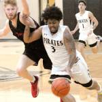 Keith Thorpe/Peninsula Daily News Peninsulas Devien Harris-Williams, front, tries to outroun Everetts Tyler Walker as Pirate teammate Everett Rores-Kahapea brings up the rear on Saturday in Port Angeles.