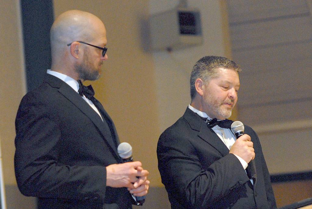 Community Awards emcees Josh Jones, left, and Tim Tucker speak at the beginning of Saturdays awards ceremony. (Keith Thorpe/Peninsula Daily News)