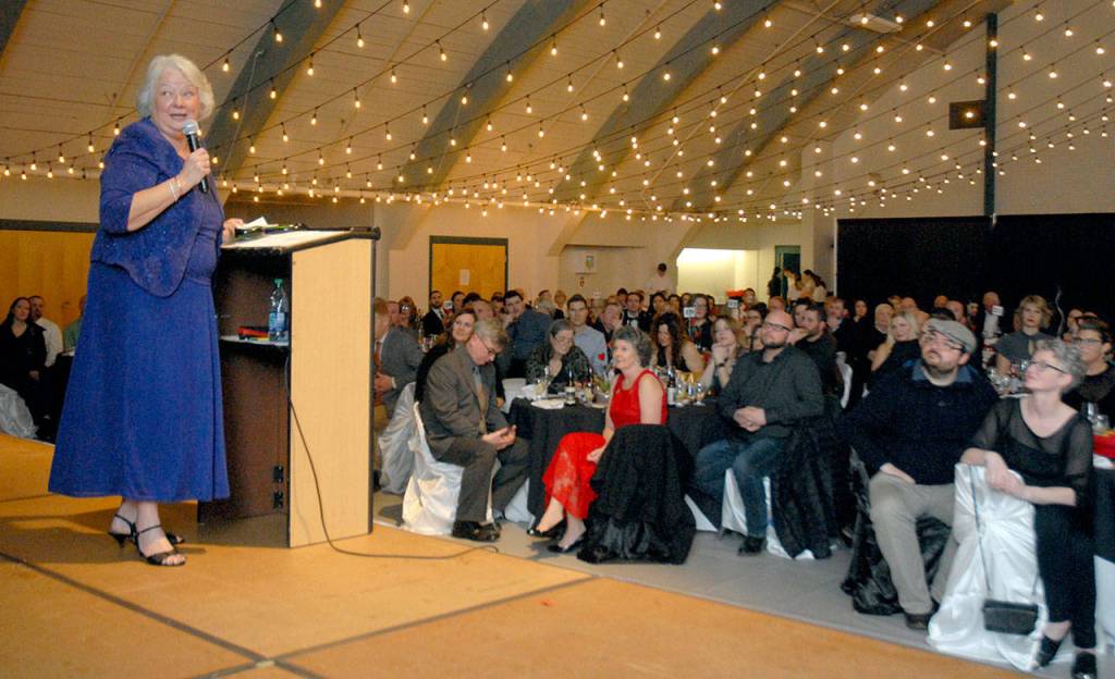 Marie Moran, widow of the late Port Angeles City Council Member Jim Moran, speaks after accepting a Port Angeles Regional Chamber of Commerce Legacy Award on behalf of her husband on Saturday. (Keith Thorpe/Peninsula Daily News)
