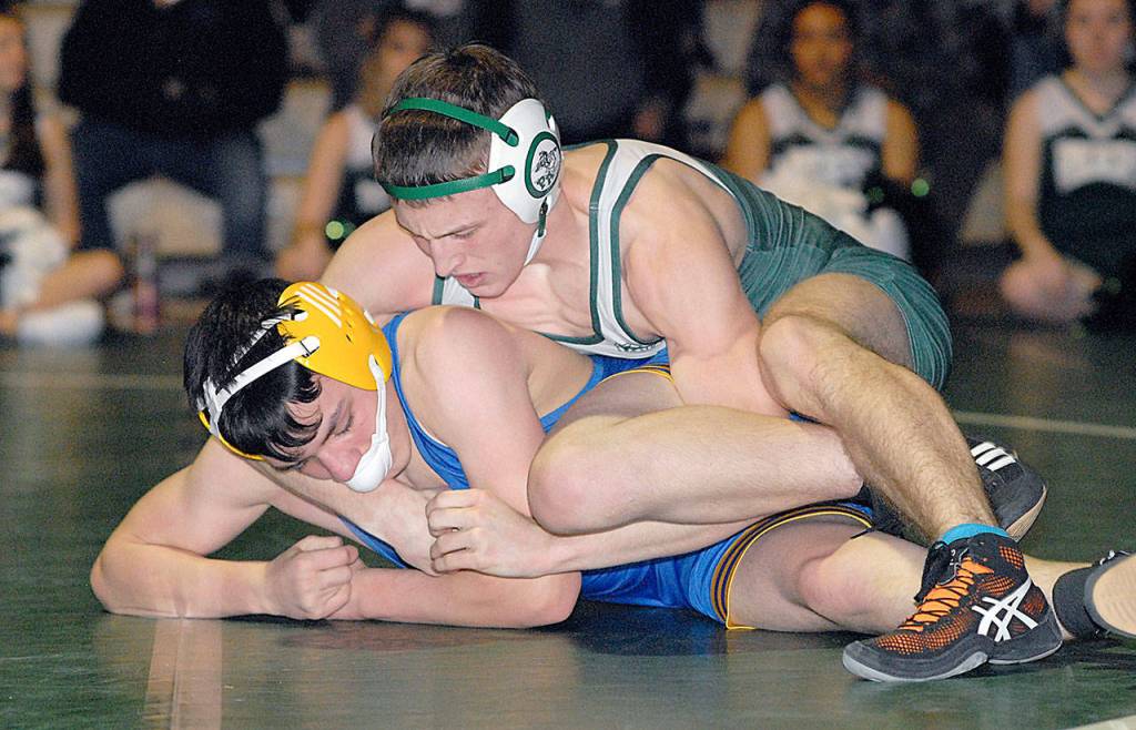Adam Borde of Port Angeles, top, wrestlies with Jacoby Serato of Bremerton in the 138-lb. weight class Wednesday in Port Angeles. (Keith Thorpe/Peninsula Daily News)