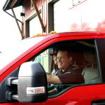 East Jefferson Fire Rescue Lt. Reece Chambers, left, and resident firefighter/EMT Matt Kaldahl leave the Chimacum Fire Station on Friday morning to respond to a medical call on Marrowstone Island. (Zach Jablonski/Peninsula Daily News)