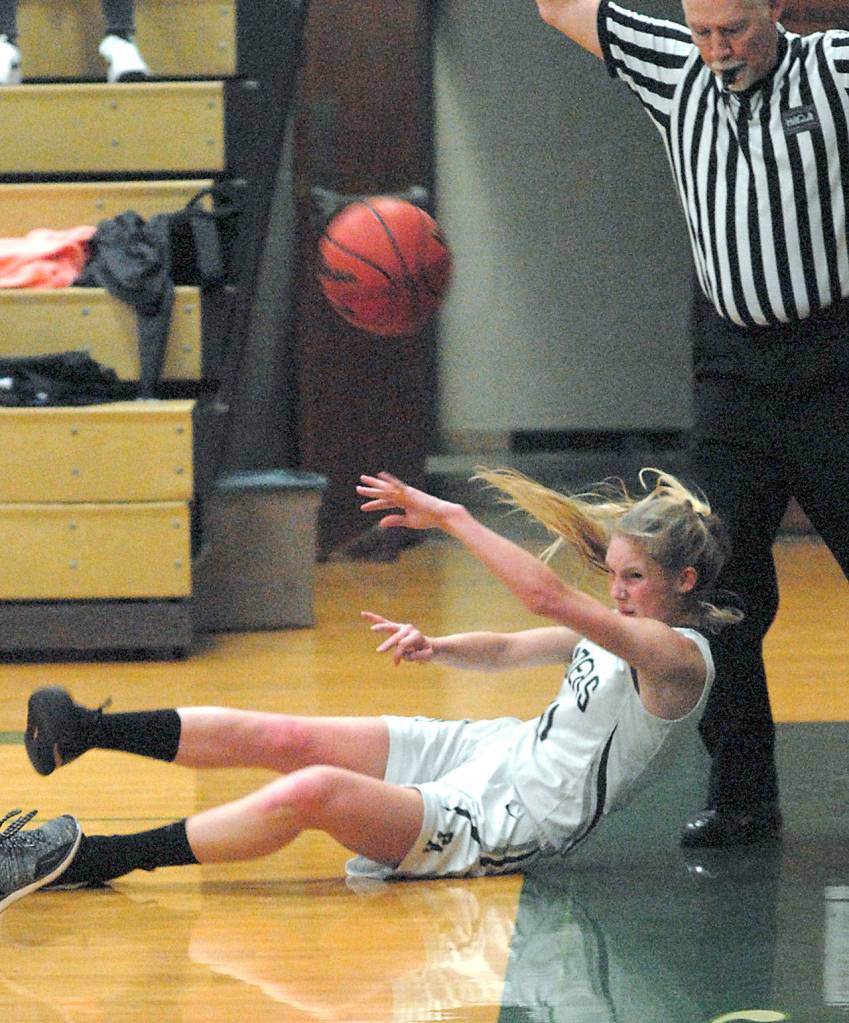 Keith Thorpe/Peninsula Daily News Port Angeles Millie Long makes a frantic throw to keep the ball inbounds during Friday nights game against Olympic in Port Angeles.