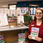 Port Townsend Public Library director Melody Eisler holds this years community read book Whiskey When Were Dry by John Larison. The book was announced at the Port Townsend City Council meeting Monday, Feb. 3, 2020. (Zach Jablonski/Peninsula Daily News)