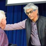Journalist Fred de Sam Lazaro chats with an attendee of his Communiversity discussion in Port Townsend. (Diane Urbani de la Paz/for Peninsula Daily News)