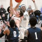 Peninsulas Nate DeSpain, center left, and Malik Moore, center right, fight for a rebound surrounded by Bellevue defenders Trey Lawrence, back, Trevon Richmond, front left, and Tijohn Rodde, front right, on Wednesday night at Peninsula College in Port Angeles. (Keith Thorpe/Peninsula Daily News)