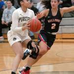 Peninsulas Casandra White, left, slips past Bellevues Rokki Brown during the third quarter on Wednesday night in Port Angeles. (Keith Thorpe/Peninsula Daily News)