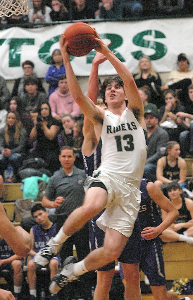 Port Angeles Stuart Methner shoots for the hoop Thursday in Port Angeles. (Keith Thorpe/Peninsula Daily News)