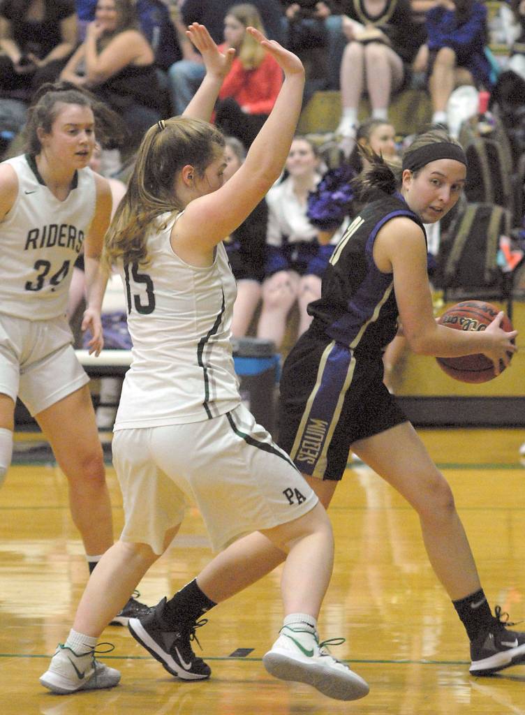 Sequims Kalli Wiker, right, gets trapped at the line by Port Angeles Myra Walker as Walkers teammate Jaida Wood, left, looks on during Thursdays game in Port Angeles. (Keith Thorpe/Peninsula Daily News)