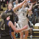 Sequims Jessica Dietzman, top left, tries to deflect a layup by Port Angeles Millie Long as Sequims Kalli Wiker, front, looks on during Thursdays game at Port Angeles High School. (Keith Thorpe/Peninsula Daily News)