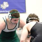 Jason Kibe of Port Angeles, left, won his 182-pound weight division at the KingCo-Olympic 2A subregionals at Belfair on Saturday. (Mark Krulish/Kitsap News Group)