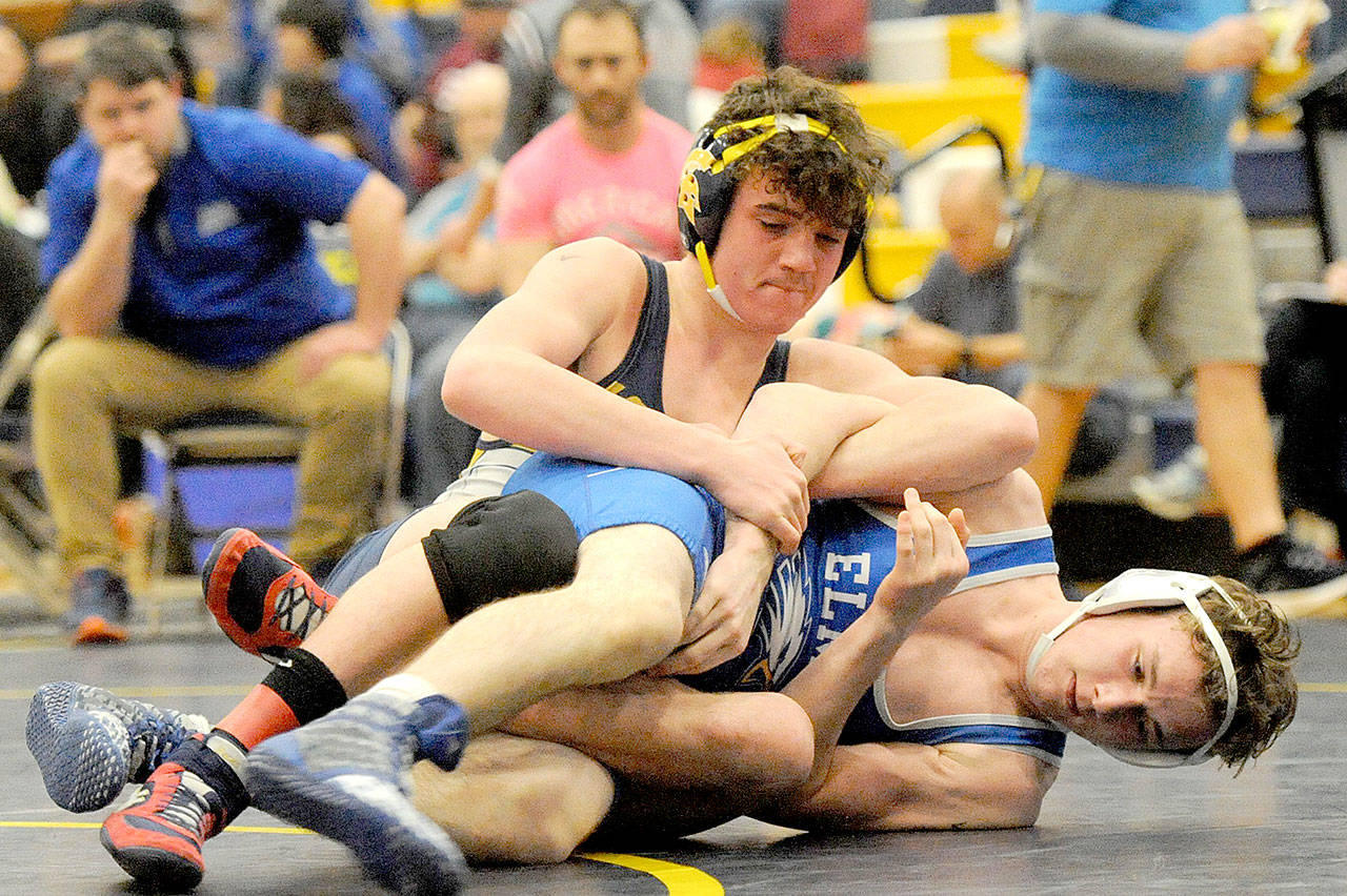 Forks Hayden Queen, top, pins Jacob Wilson of Elma. Queen went on to win his 170-pound weight division at the Evergreen 1A subregionals Saturday in Forks. (Lonnie Archibald/for Peninsula Daily News)