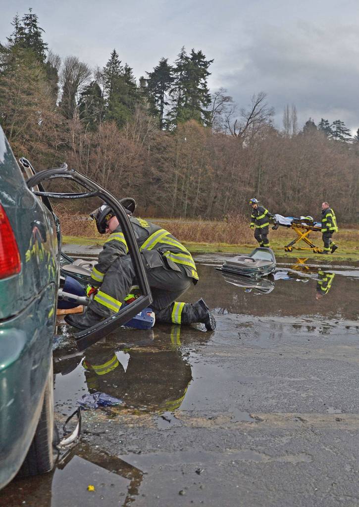Port Angeles Fire Department firefighters run a rescue drill at the old Rayonier site in Port Angeles on Thursday, Jan. 23, 2020. (Laura A. Foster/Peninsula Daily News)