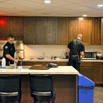 Paramedics Tyler Gage, left, and Doug Eaton work together to keep the kitchen tidy at the Port Angeles Fire Department. (Laura A. Foster/Peninsula Daily News)