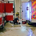 Paramedic Doug Eaton checks supplies from an ambulance in the Port Angeles Fire Department truck bay at the beginning of a 24-hour shift. (Laura A. Foster/Peninsula Daily News)