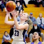 <strong>Conor Dowley</strong>/Olympic Peninsula News Group                                Sequims Melissa Porter goes up for a layup against Foster on Wednesday. Porter scored 14 of her game-high 19 points on the night off of fast breaks.