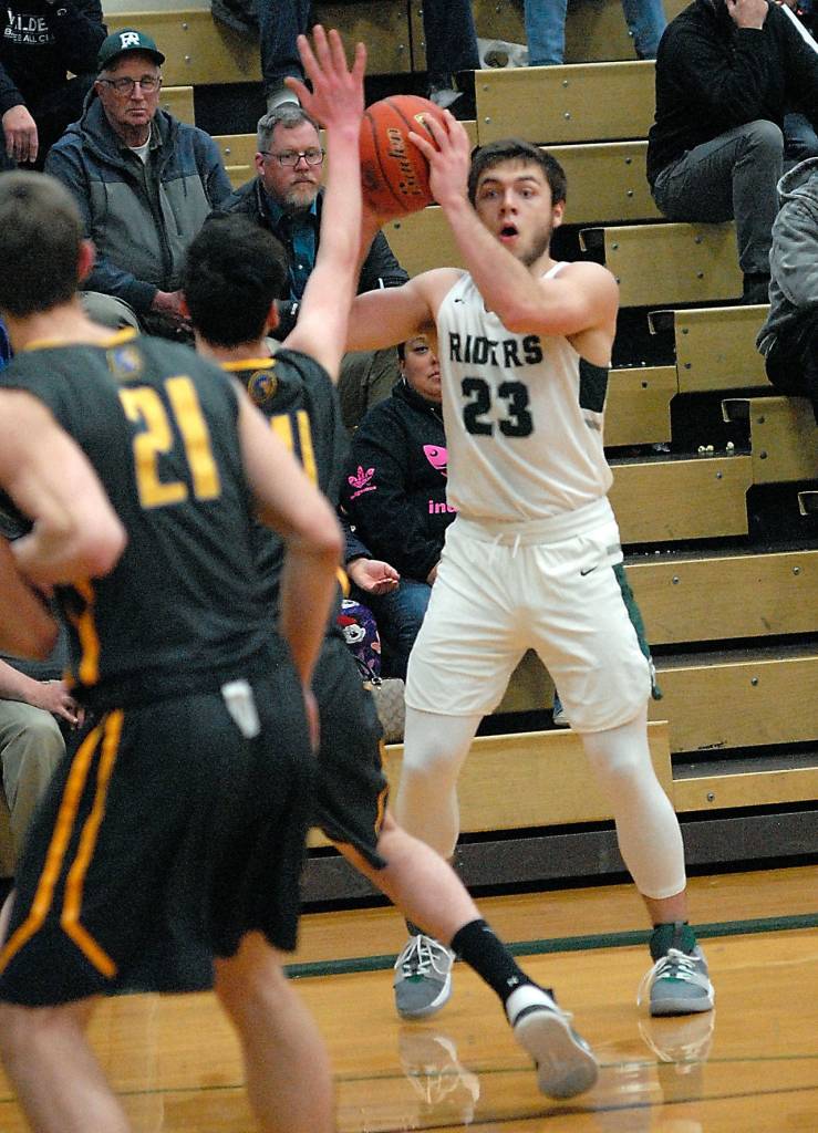 Keith Thorpe/Peninsula Daily News Port Angeles Anton Kathol, right, looks for his teammates on Thursday night against Fife.