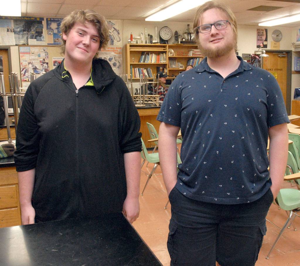 A bridge built by Jonathan Daracunas, left, with assistance from Zephie Waldron withstood a force of 245 pounds. (Keith Thorpe/Peninsula Daily News)