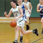 Keith Thorpe/Peninsula Daily News Port Angeles Bailee Larson, front, drives down court pursued by Eatonvilles Madison Dunbar and Brooklynn Lucht, right, on Friday night in Port Angeles.