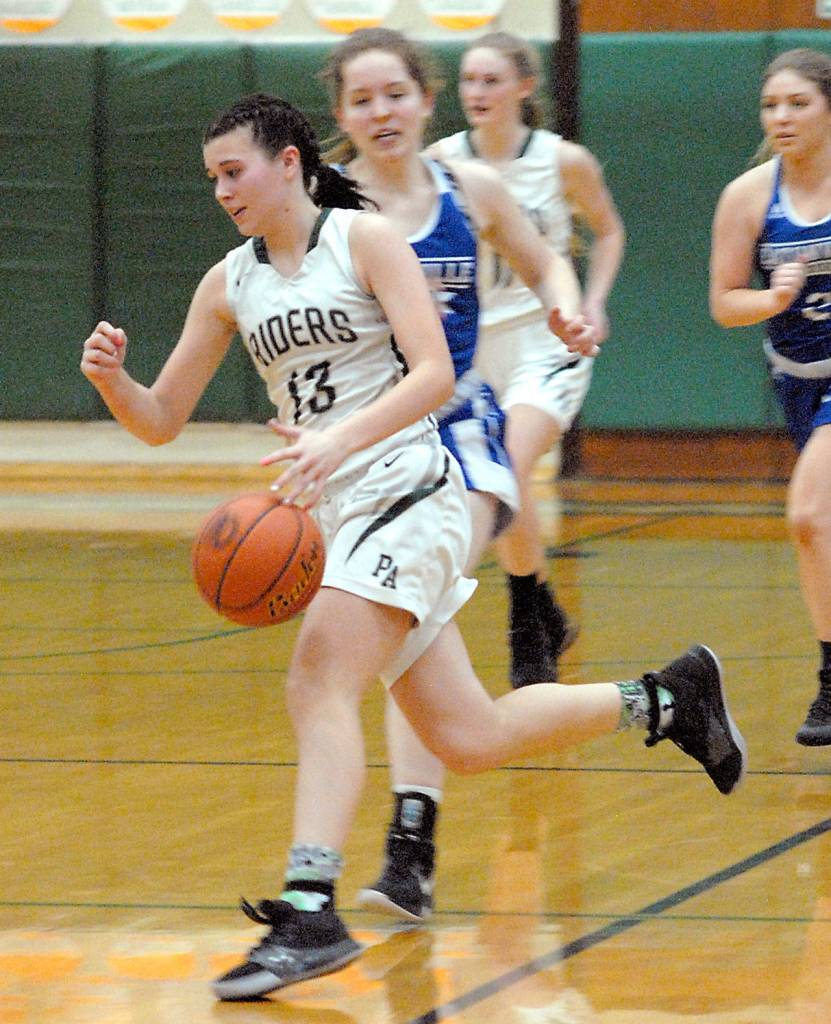 Keith Thorpe/Peninsula Daily News Port Angeles Bailee Larson, front, drives down court pursued by Eatonvilles Madison Dunbar and Brooklynn Lucht, right, on Friday night in Port Angeles.