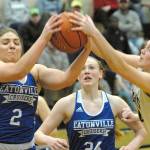 Keith Thorpe/Peninsula Daily News Eatonvilles/Brooklynn Lucht, left, and Port Angeles Jaida Wood, right, fight for a rebound as Eatonvilles Kya Stewart looks on during the second quarter of Friday nights game in Port Angeles.