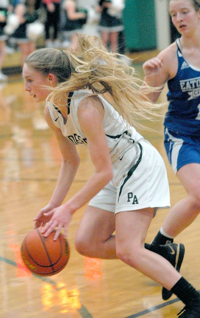 Keith Thorpe/Peninsula Daily News Millie Long of Port Angeles pushes past Eatonvilles Hailey Rath in the second quarter of Fridays playoff game at Port Angeles High School.