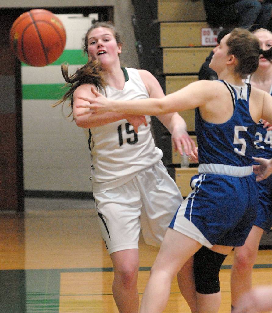 Keith Thorpe/Peninsula Daily News Port Angeles Myra Walker, left, makes a pass around Eatonvilles Madison Dunbar on Friday in Port Angeles.