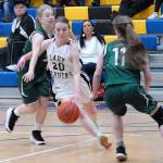 Keith Thorpe/Peninsula Daily News Clallam Bays Cedar Johnson, center, cuts between Cedar Park Christians Trifine Worrell, left, and Parker Reymore on Saturday in Joyce.