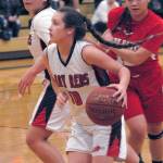 Neah Bays Allie Green, front, evades the defense of Tulalip Heritages Deachae Jones, right, as Greens teammate, Oceana Aguirre, left, clears the way on Tuesday in Port Angeles. (Keith Thorpe/Peninsula Daily News)