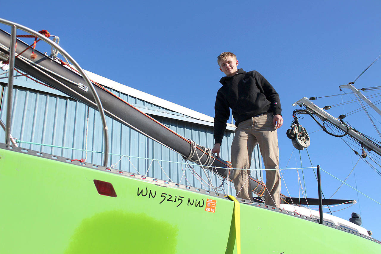 Team FAST Skipper Odin Smith stands aboard his teams vessel Wednesday morning. The team recently purchased the boat on Monday and though it has not been christened yet, it has been nicknamed the Limey Bastard. (Zach Jablonski/Peninsula Daily News)