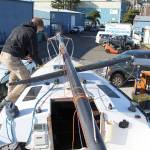 Team FAST Skipper Odin Smith removes the chain plate that is going to be replaced on the teams 27-feet-long sloop. (Zach Jablonski/Peninsula Daily News)