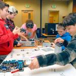 Children crack open computers at Port Angeles Library teardown event