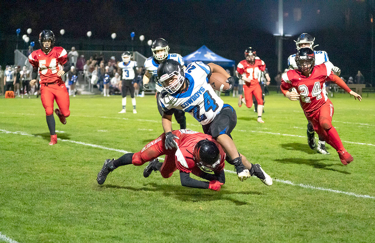 Chimacums Anson Jones runs with the football during a game against Port Townsend last fall. The Cowboys will compete in the Class 1B/2B Northwest League next season, school administrators announced. (Steve Mullensky/for Peninsula Daily News)