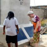Doc Reiss, left, inspects one of the Dignity toilets that he helped install in Togo, Africa. (NorWester Rotary)