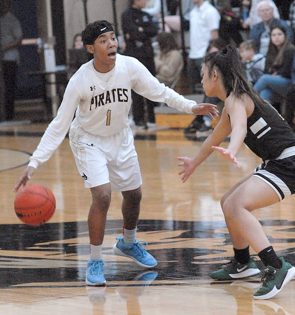 Peninsulas Kayla Johnson, left, calls her teammates as Shorelines Raelyn Kimmel in Wednesdays NWAC North League game in Port Angeles. (Keith Thorpe/Peninsula Daily News)