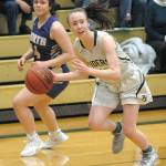 Port Angeles Mikkiah Brady, right, dribbles by North Kitsaps Noey Barreith during a January game at Port Angeles High School. (Keith Thorpe/Peninsula Daily News)
