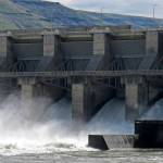 FILE - In this April 11, 2018 file photo, water moves through a spillway of the Lower Granite Dam on the Snake River near Almota, Wash. Farmers, environmentalists, tribal leaders and public utility officials are eagerly awaiting a federal report due Friday, Feb. 28, 2020, that could decide the fate of four hydroelectric dams on the Snake River. (AP Photo/Nicholas K. Geranios,File)