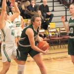 Port Angeles Jaida Wood looks to pass against Tumwater in the Roughriders 58-57 loss Saturday at Mount Tahoma High School. At right is the Riders Mikkiah Brady. (Mark Krulish/Kitsap News Group)