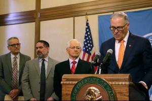 Coronavirus kills 11 in Washington; school district closes