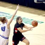 Photos by Chris Johnson/for Peninsula Daily News Neah Bays Ruth Moss, right, goes up for a layup during the Red Devils 55-53 loss to Curlew at the Class 1B Girls Basketball State Tournament at Spokane Arena on Friday.