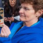 Pat Herrick holds a photo of her mother, Elaine, a resident of Life Care Center who died earlier in the day Thursday, March 5, 2020, in Kirkland. Family members of residents of the nursing home where multiple people have died from the coronavirus spoke to the media about their loved ones as Washington state authorities reported dozens more cases. (Steve Ringman/The Seattle Times via AP)
