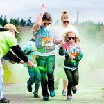 Heart and Passion Films                                Port Angeles Amanda and Heidi Kiddle run through the green color zone at the Sun Fun Color Run on Saturday.