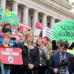 Dissatisfied residents hold signs in protest of comprehensive sex education mandate. (Cameron Sheppard/WNPA News Service)