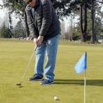 Jim Root of Port Angeles practices his putting Tuesday at Peninsula Golf Course in Port Angeles. (Keith Thorpe/Peninsula Daily News)