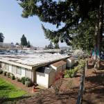 The single-story Life Care Center is seen Wednesday, March 18, 2020, in Kirkland. Staff members who worked while sick at multiple long-term care facilities contributed to the spread of COVID-19 among vulnerable elderly in the Seattle area, federal health officials said Wednesday. (Elaine Thompson/The Associated Press)