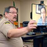 Clallam County Undersheriff Ron Cameron, left, fields questions as Dr. Allison Berry Unthank, the countys public health officer, delivers COVID-19 updates through a video link from her home on Wednesday morning at the Clallam County Courthouse in Port Angeles. (Keith Thorpe/Peninsula Daily News)