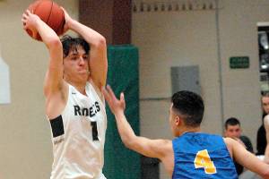 ALL PENINSULA BOYS BASKETBALL: Port Angeles’ Gary Johnson lifted his Roughrider teammates