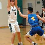 Port Angeles Gary Johnson, left, shown in a February game against Bremerton, is the All-Peninsula Boys Basketball MVP as selected by area coaches and the sports staff of the Peninsula Daily News. (Keith Thorpe/Peninsula Daily News)